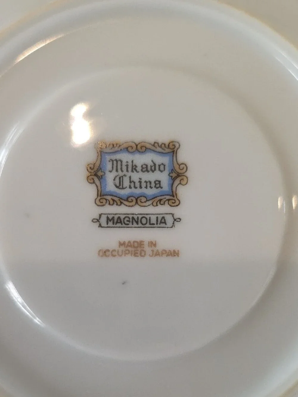 Mikado Porcelain Tea Cup and Saucer Set with Pink Floral Accents and Gold Trim